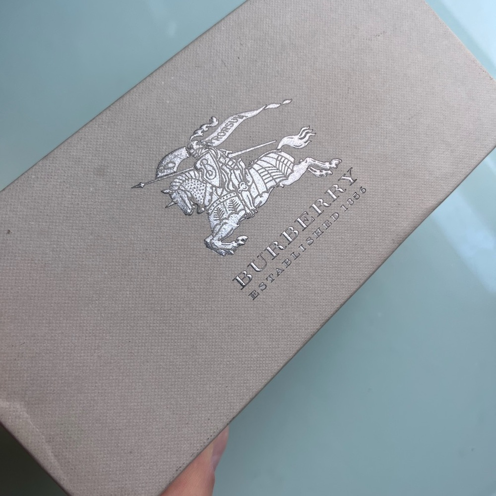 Boxes from luxury brands for sunglasses and belts
